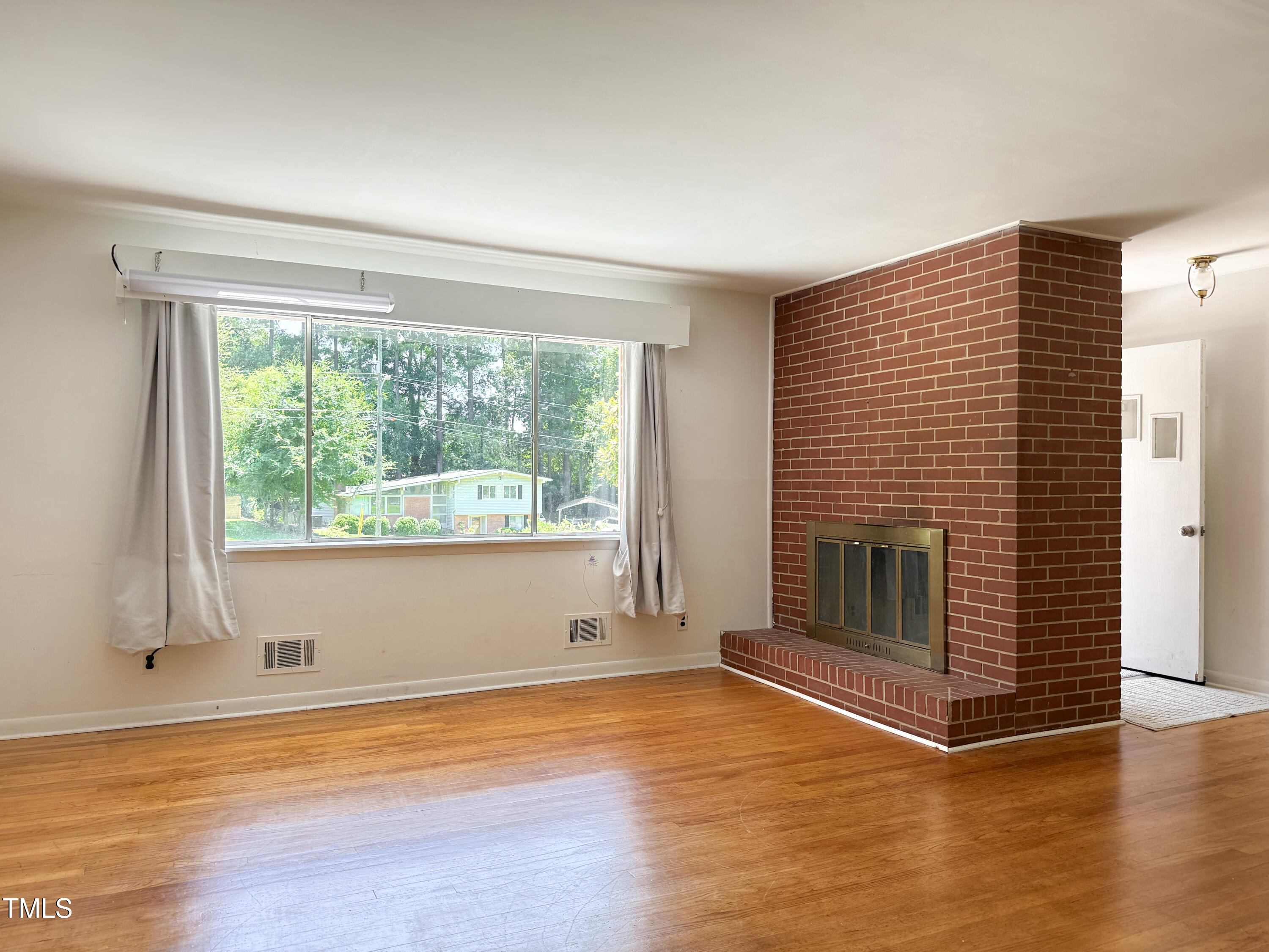 3323 Baugh Street Raleigh, NC 27604 - Photo 12 of 52 a view of empty room with wooden floor and fan