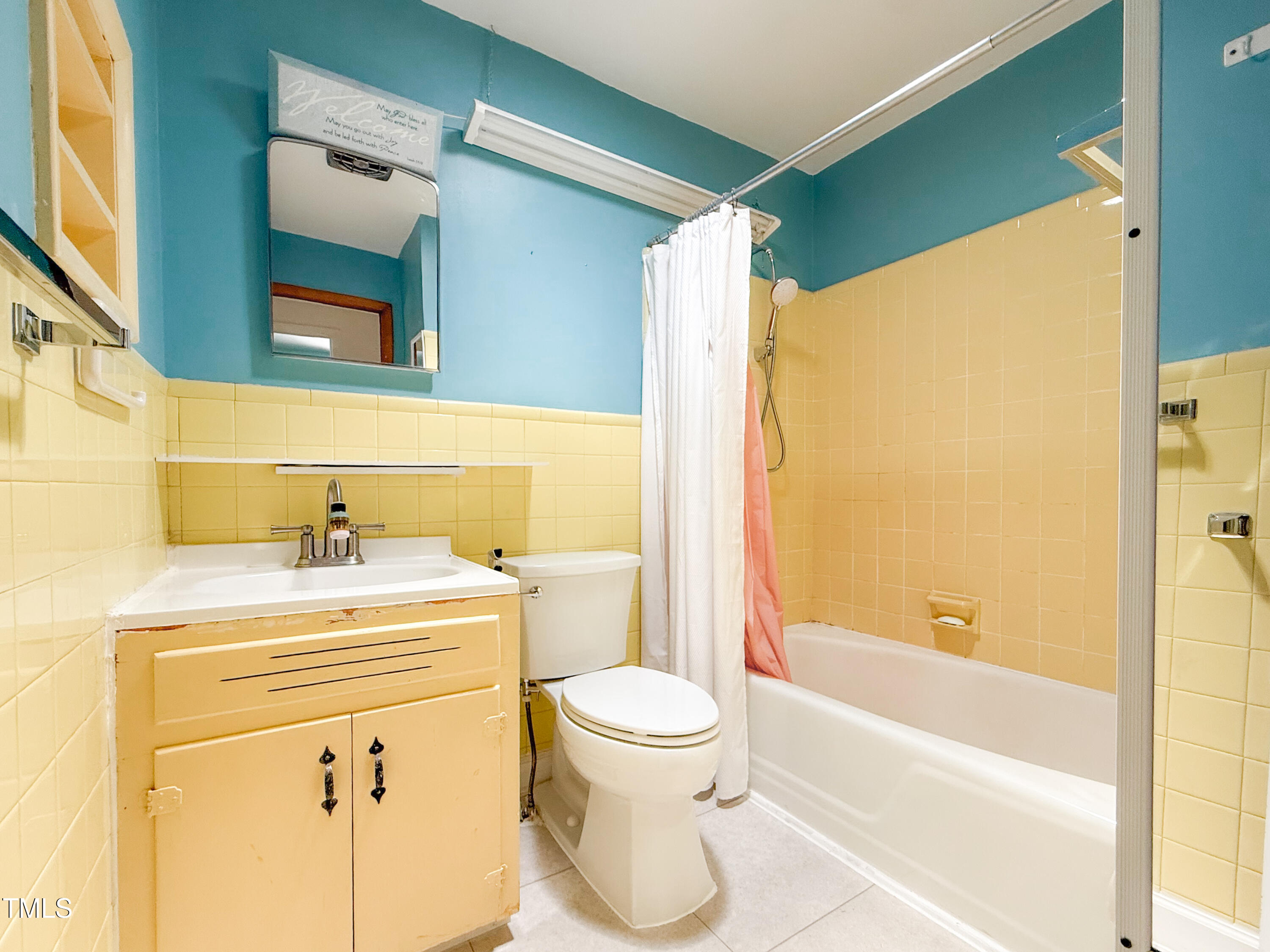 3323 Baugh Street Raleigh, NC 27604 - Photo 29 of 52 a bathroom with a sink a toilet and a bathtub