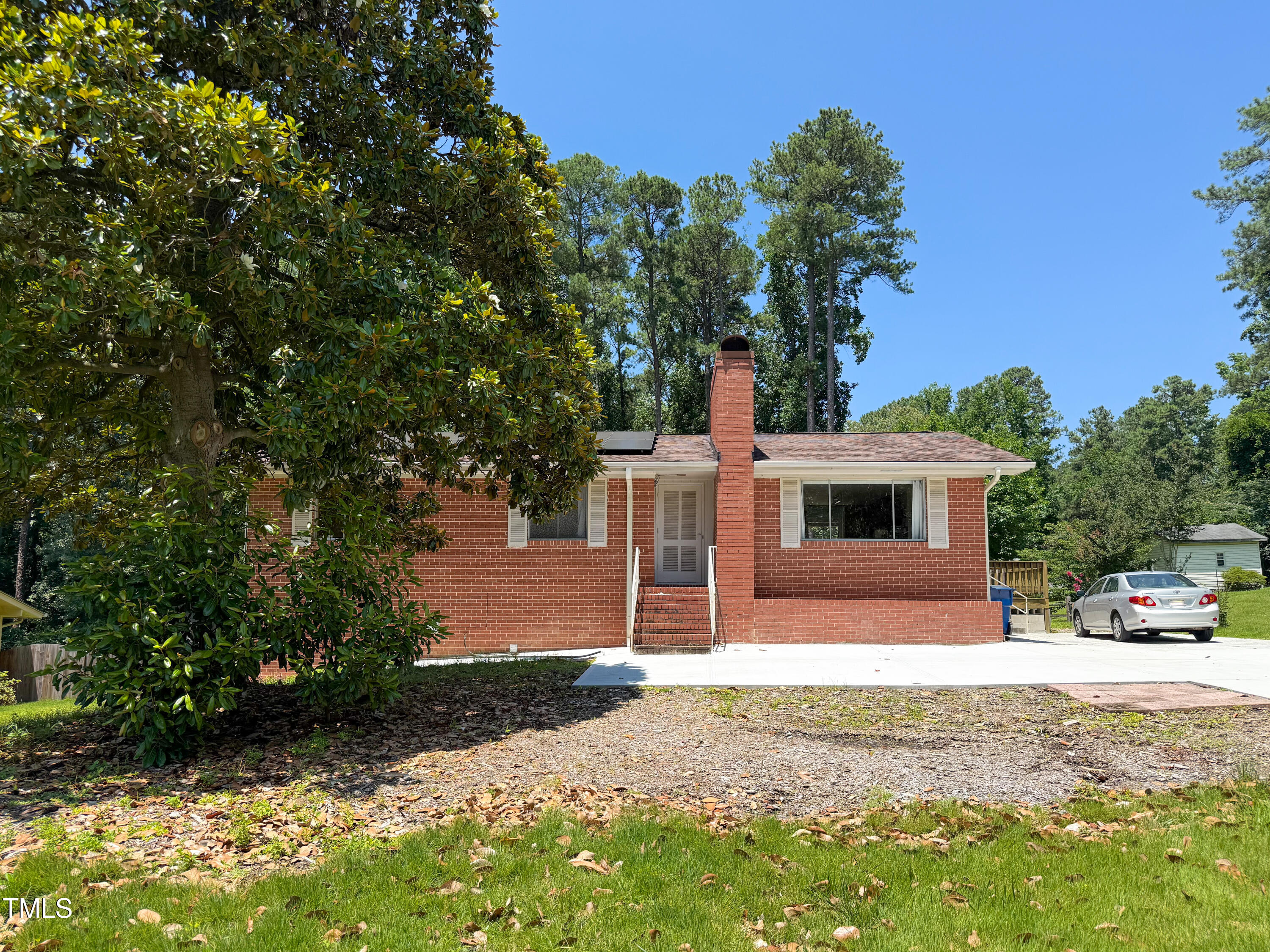 3323 Baugh Street Raleigh, NC 27604 - Photo 4 of 52 a front view of a house with a yard and garage
