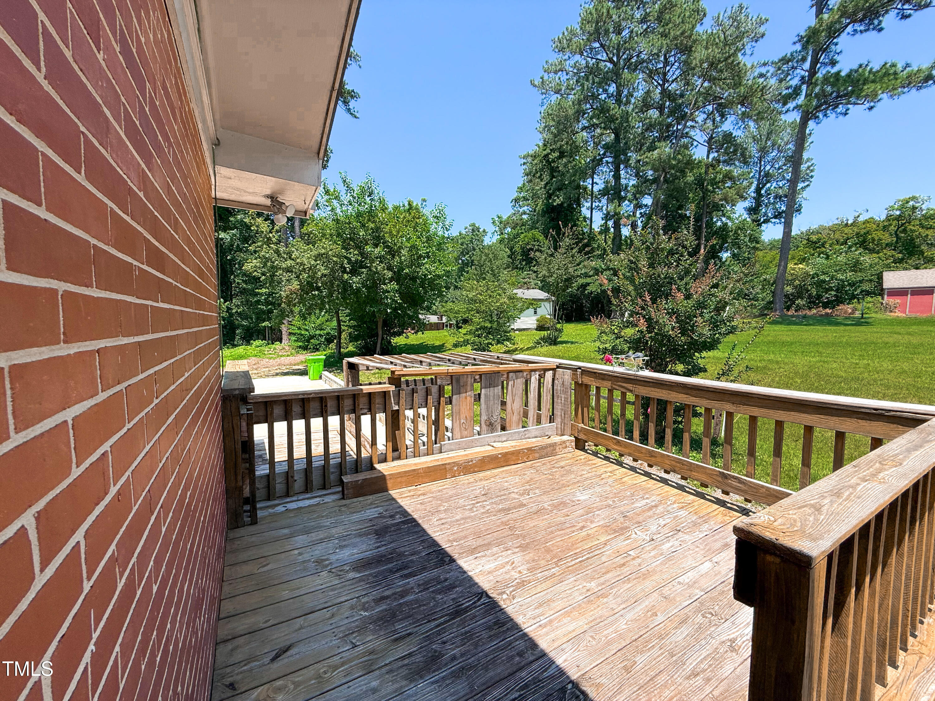 3323 Baugh Street Raleigh, NC 27604 - Photo 45 of 52 a balcony with wooden floor and fence