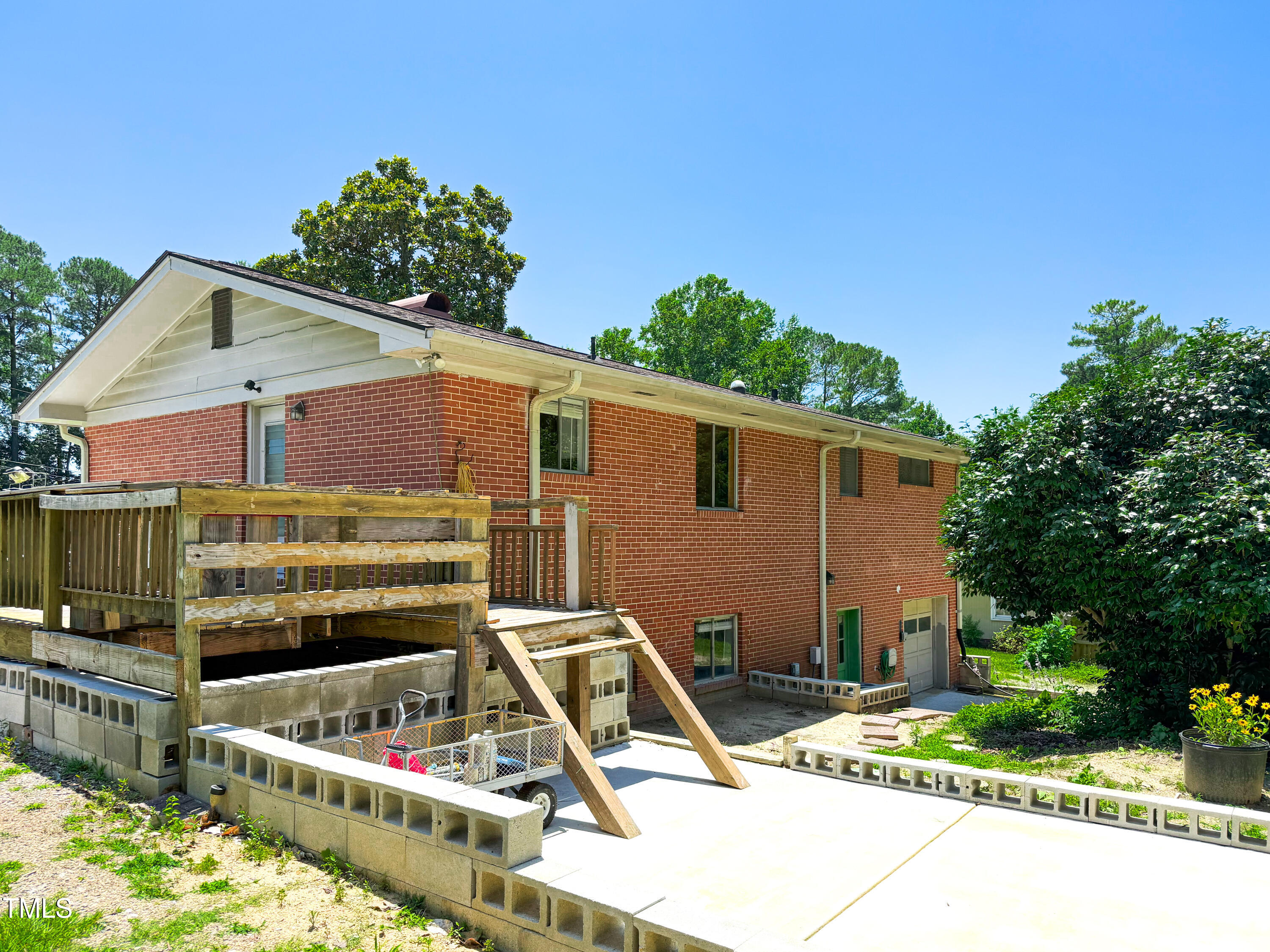 3323 Baugh Street Raleigh, NC 27604 - Photo 46 of 52 a front view of a house with a garden