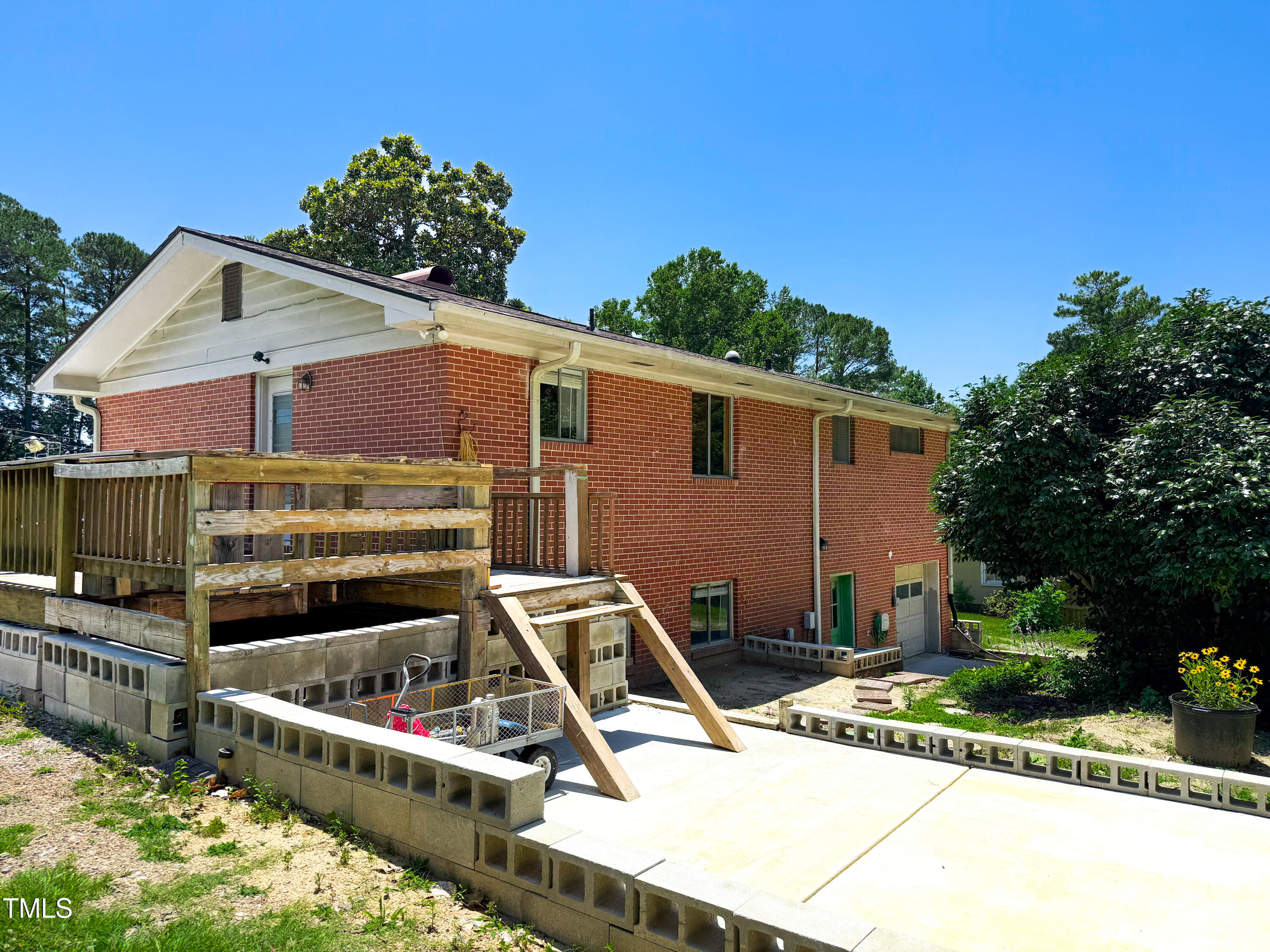 3323 Baugh Street Raleigh, NC 27604 - Photo 47 of 52 a view of a house with backyard tub and chairs