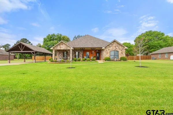 a view of a house with a big yard