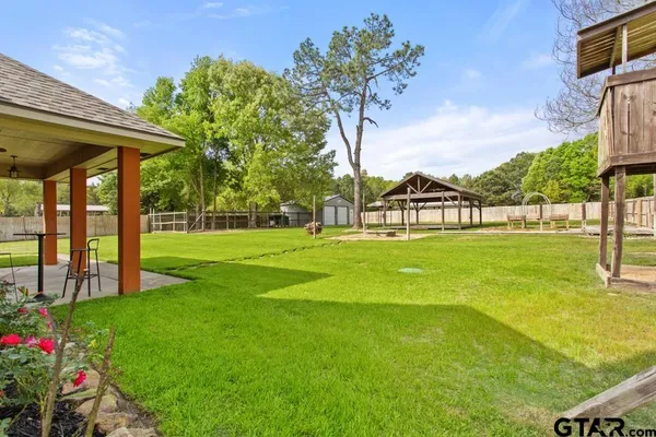 a view of a playground with a garden