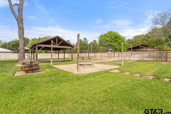 a view of a swimming pool with a yard