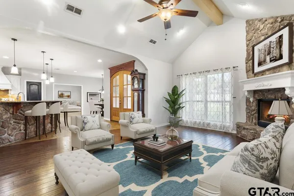 a living room with furniture and a large window