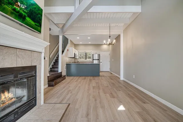 a kitchen with stainless steel appliances granite countertop a refrigerator and a stove top oven