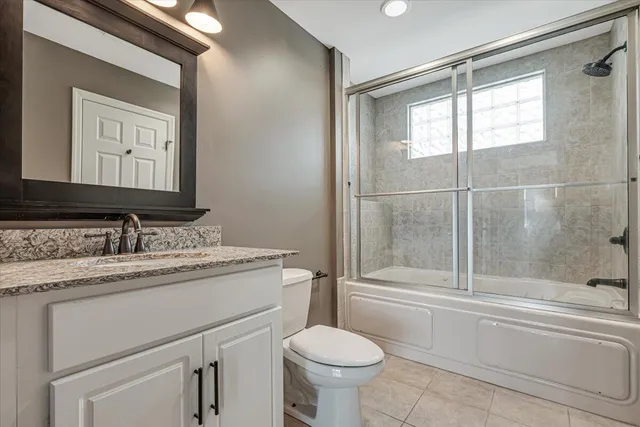 a view of a storage and utility room with washer and dryer