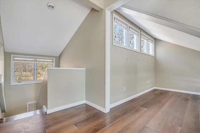 a bedroom with a large bed and a large window