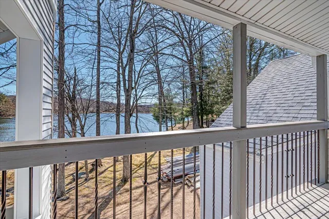 a view of a lake with houses in the back