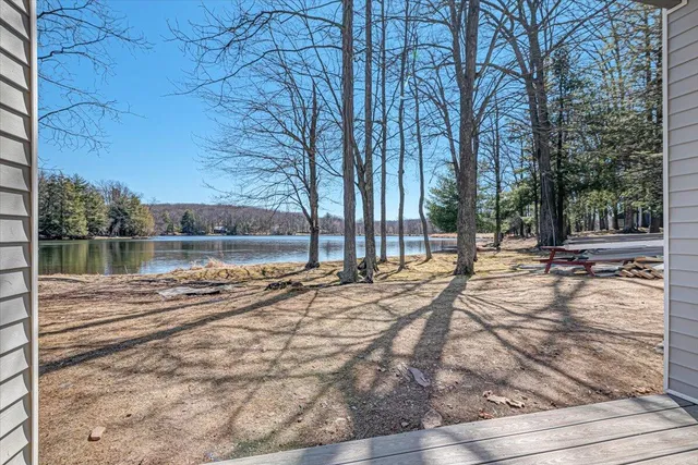 an aerial view of residential building and lake