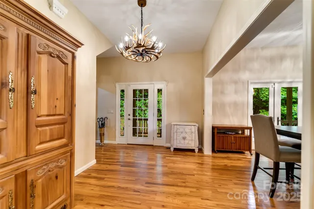 a view of a livingroom with furniture window and wooden floor
