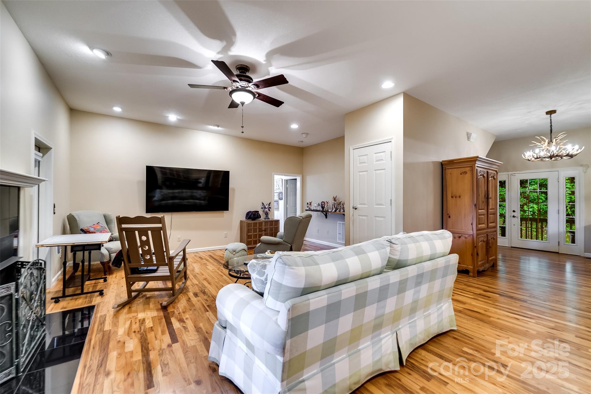 1838 Coman Road Franklin, NC 28734 - Photo 17 of 48 a living room with furniture and a flat screen tv