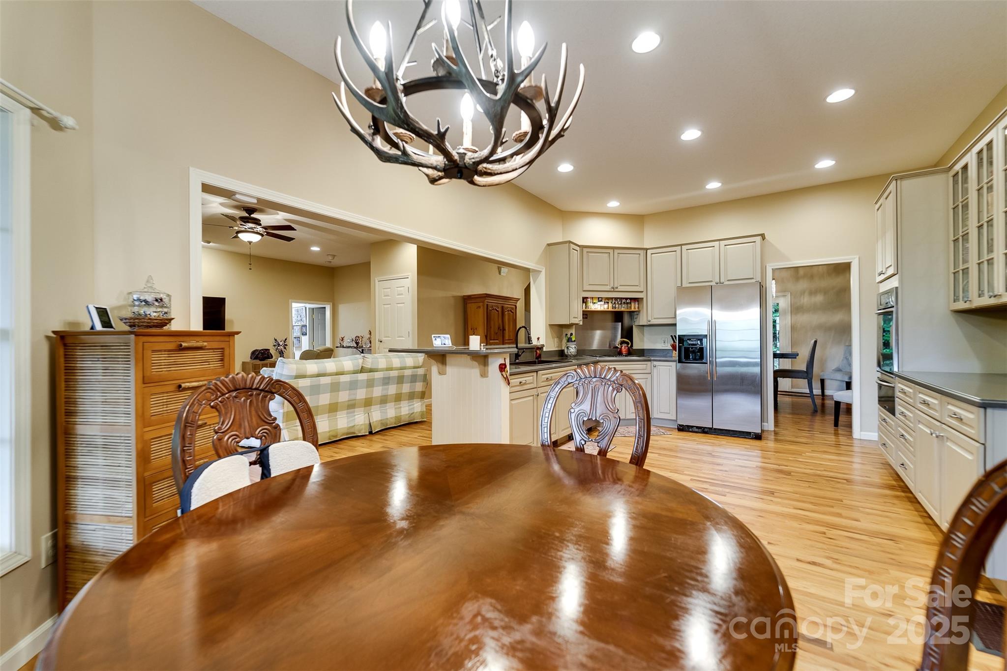 1838 Coman Road Franklin, NC 28734 - Photo 20 of 48 a room with lots of chairs and a chandelier