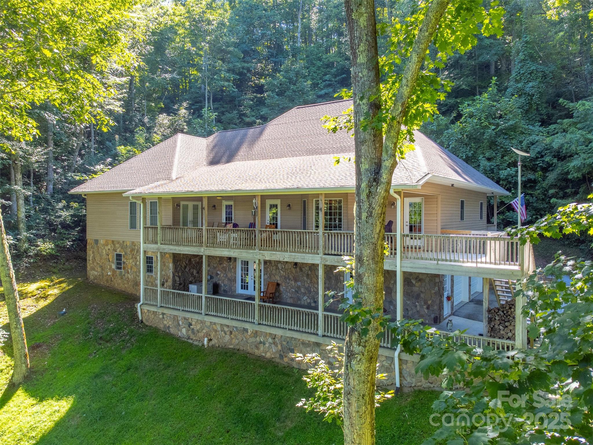 1838 Coman Road Franklin, NC 28734 - Photo 2 of 48 a front view of a house with a garden
