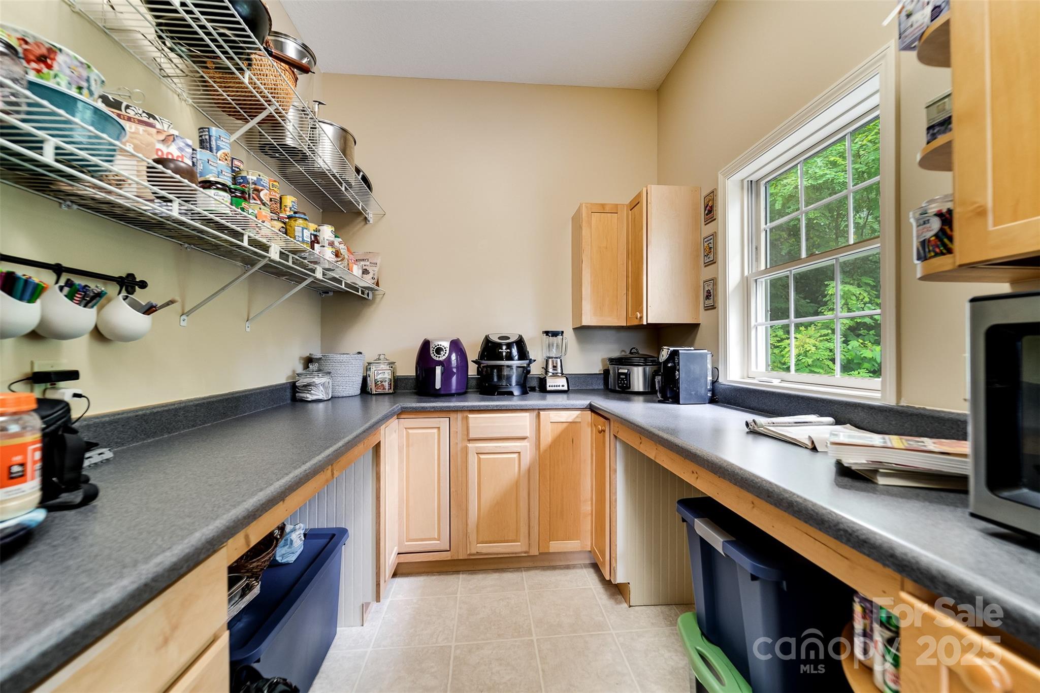 1838 Coman Road Franklin, NC 28734 - Photo 24 of 48 a kitchen with stainless steel appliances a sink a stove and a window