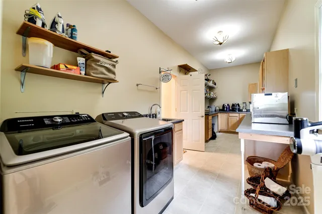 a kitchen with stainless steel appliances granite countertop a stove and a sink