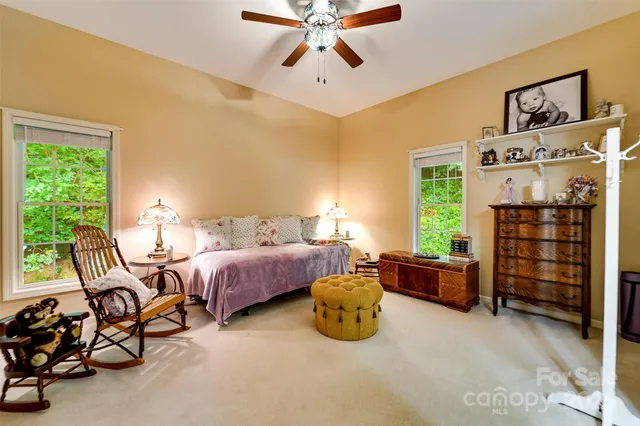 a bed room with furniture and a window