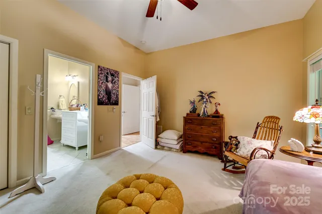 a view of a livingroom with furniture and a flat screen tv