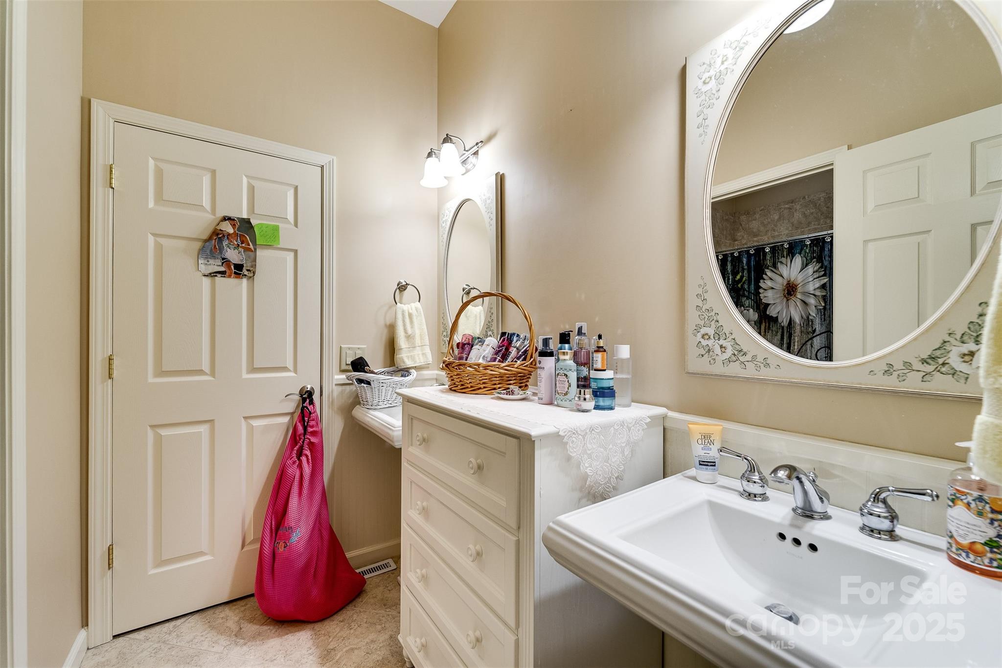 1838 Coman Road Franklin, NC 28734 - Photo 31 of 48 a bathroom with a sink and a mirror