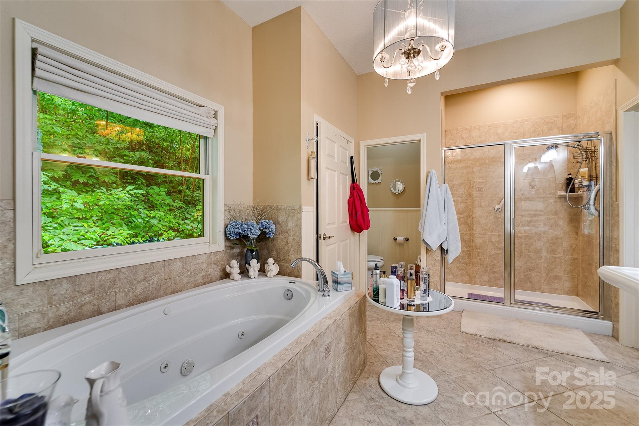 1838 Coman Road Franklin, NC 28734 - Photo 36 of 48 a bathroom with a tub sink and mirror