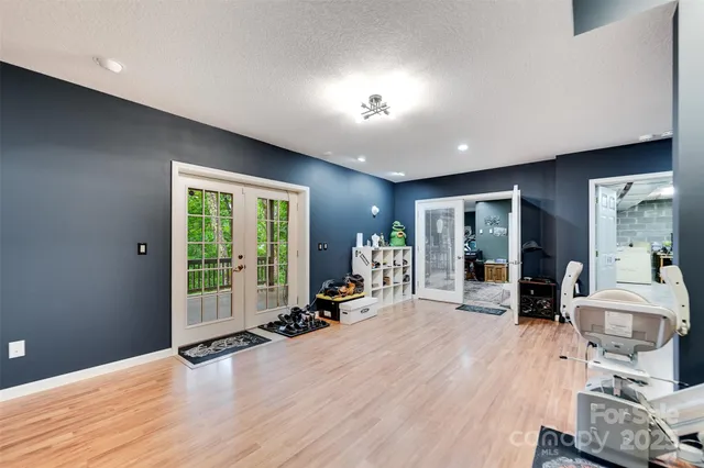 a living room with furniture window and wooden floor