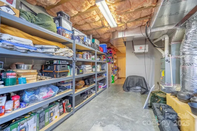 a room with lots of books and a large window
