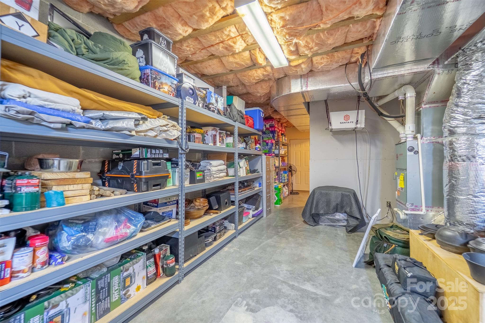 1838 Coman Road Franklin, NC 28734 - Photo 43 of 48 a room with lots of books and a large window