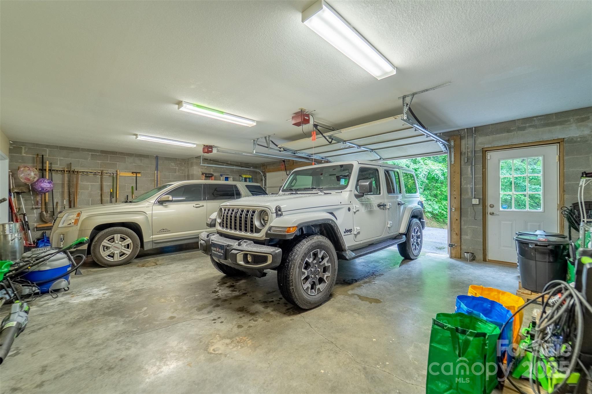 1838 Coman Road Franklin, NC 28734 - Photo 45 of 48 a view of a garage with cars parked