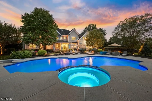 a swimming pool with outdoor seating and yard