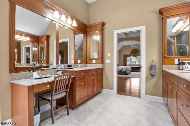 a bathroom with a sink vanity and a mirror