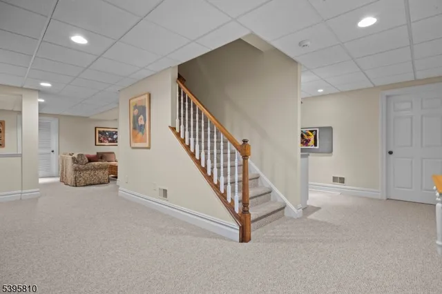 a view of an empty room with white walls