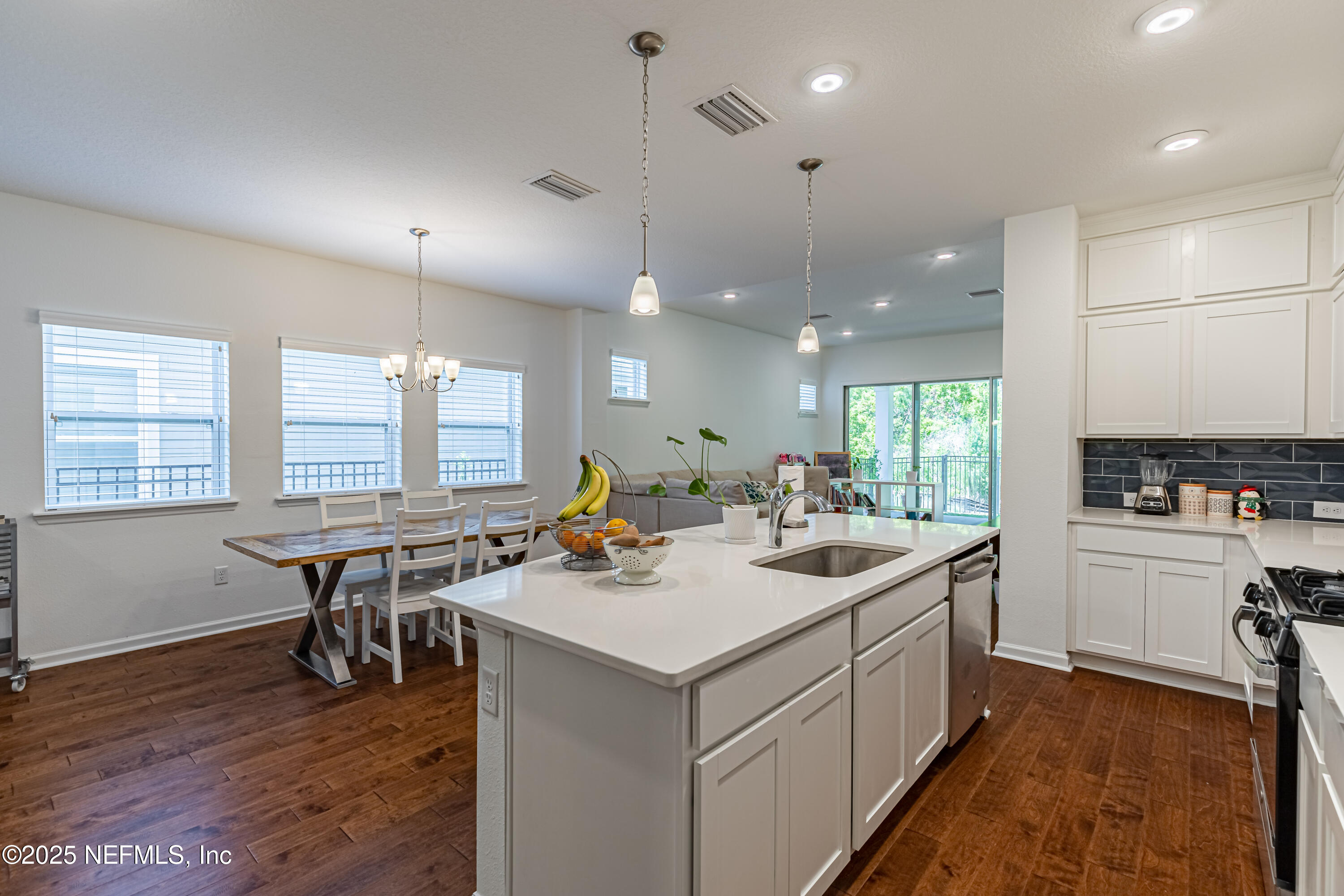 383 Windswept Way Street St. Augustine, FL 32092 - Photo 15 of 34 a kitchen with a sink a counter space appliances and cabinets