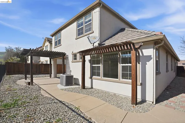 a living room with furniture and windows