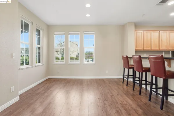 a kitchen with stainless steel appliances granite countertop a stove top oven microwave and cabinets