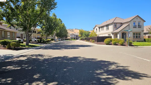 a view of a playground with a yard