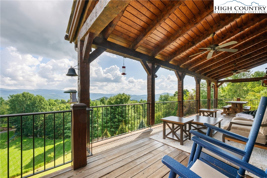 333 Windy Ridge Road Vilas, NC 28692 - Photo 46 of 46 a view of a chairs and tables in the balcony