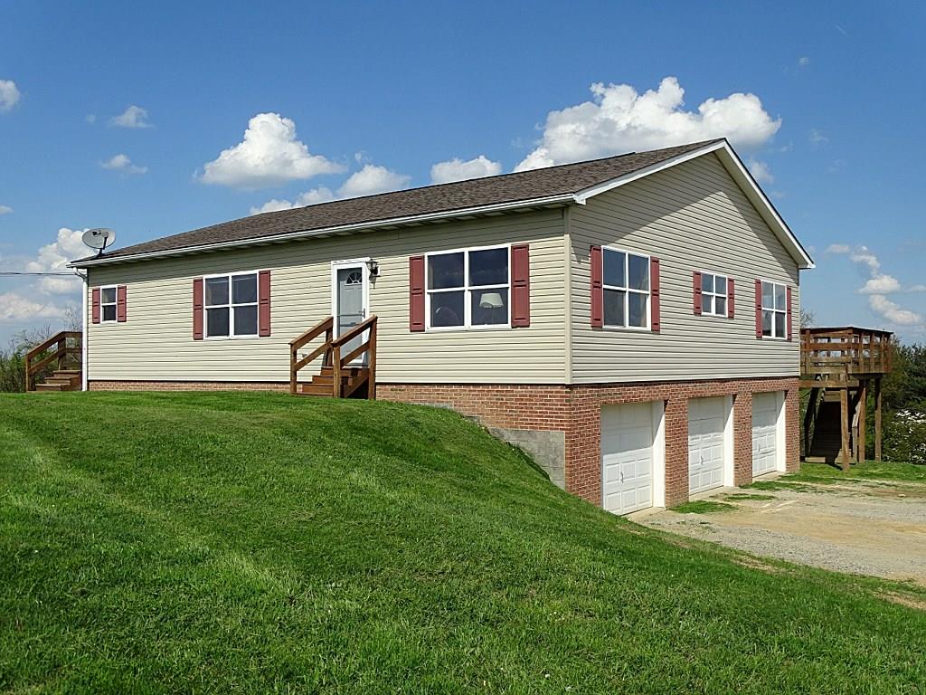 Vinyl & Brick Ranch with 3 Car Garage!