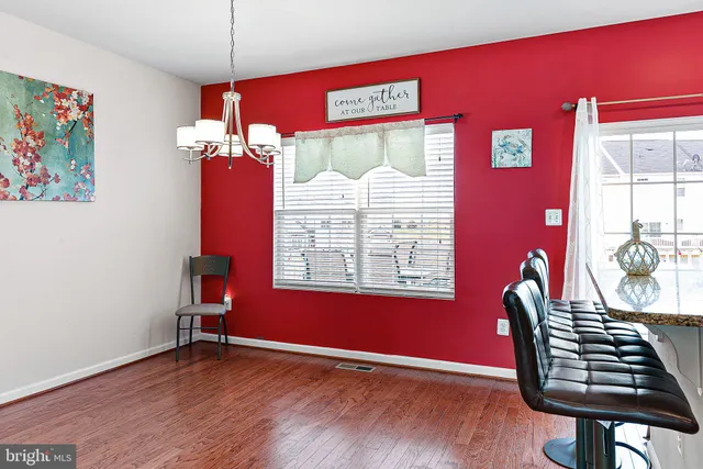 a view of a livingroom with furniture window and wooden floor