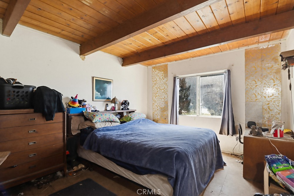 736 Sacramento Avenue Spring Valley, CA 91977 - Photo 13 of 33 a bedroom with furniture and a large window