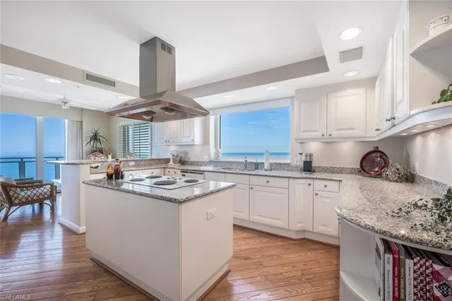 a kitchen with stainless steel appliances granite countertop a sink and cabinets