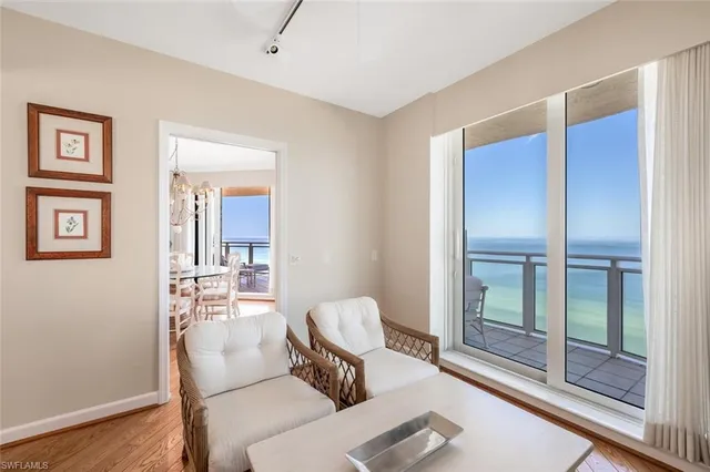 a bedroom with bed and a chandelier