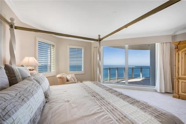 a bedroom with a bed and a mirror