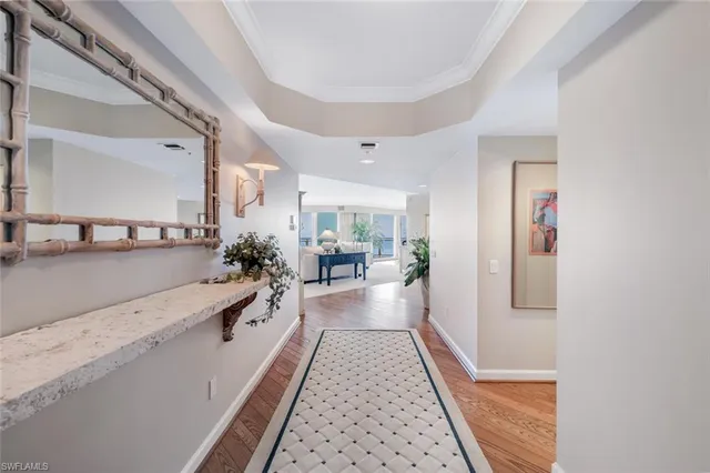 a bathroom with a granite countertop tub a sink and a large mirror