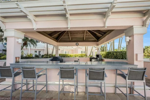 a swimming pool view with a outdoor seating