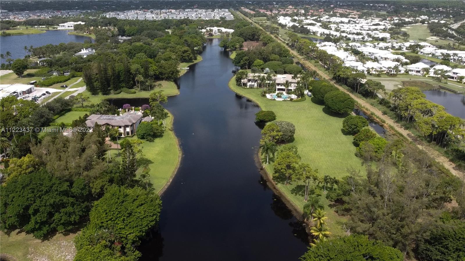 6017 Le Lac Road Boca Raton, FL 33496 - Photo 1 of 46 a view of a garden with lawn chairs