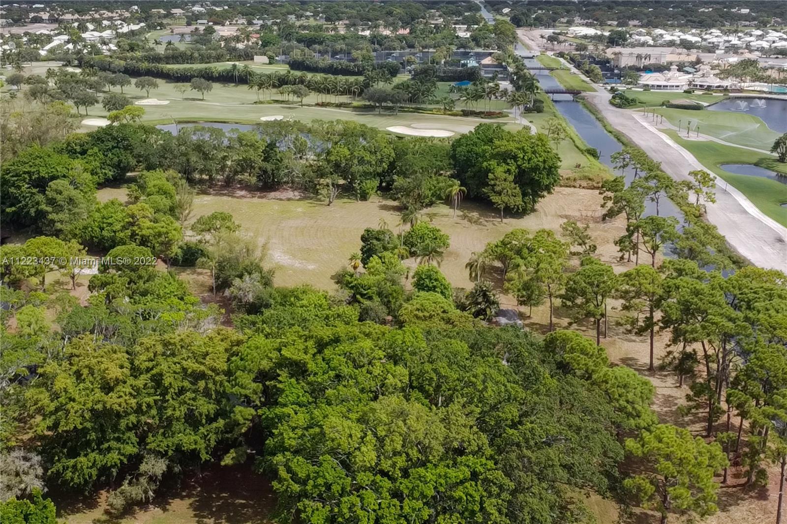6017 Le Lac Road Boca Raton, FL 33496 - Photo 22 of 46 a view of a lake with a city