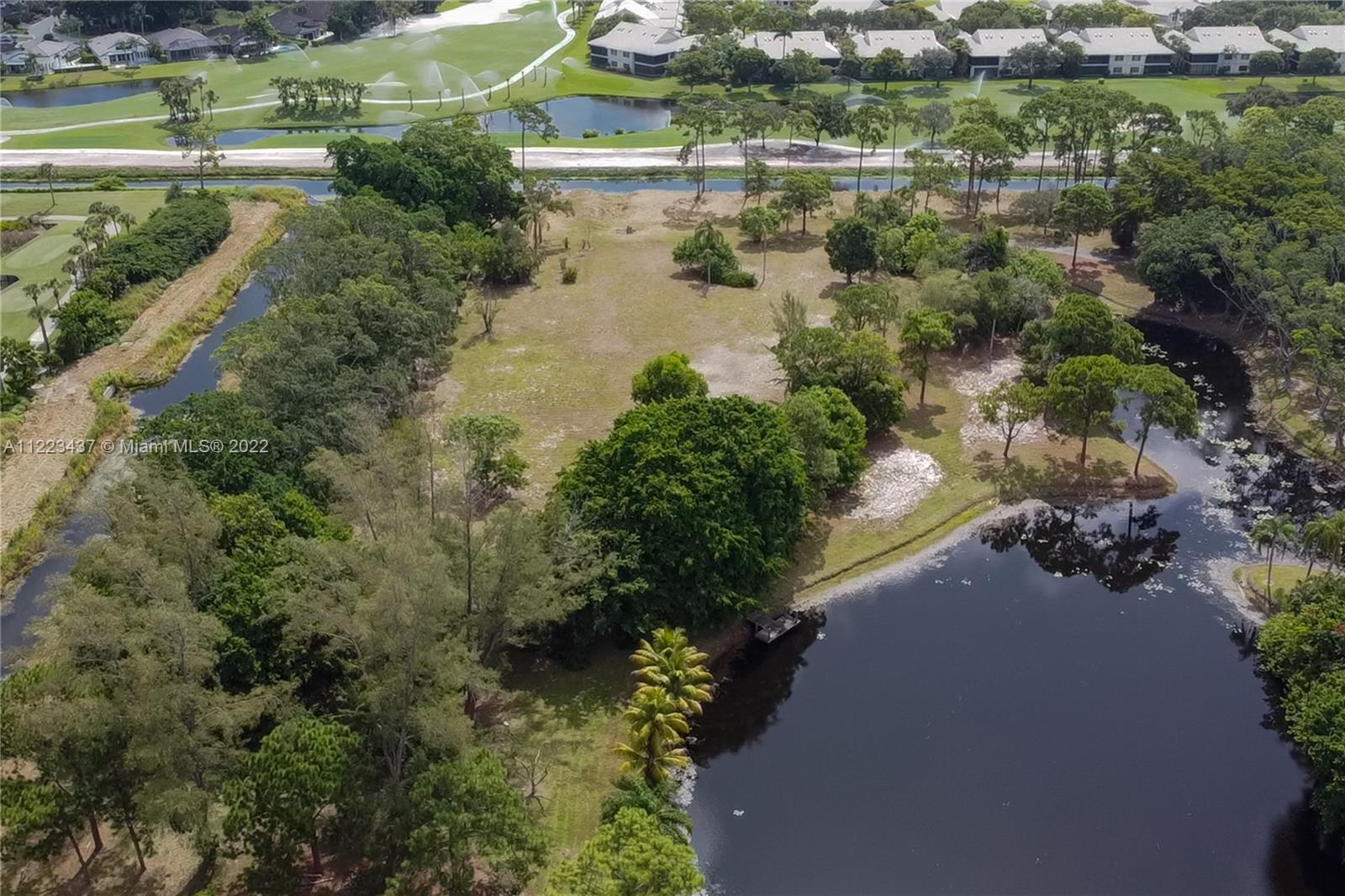 6017 Le Lac Road Boca Raton, FL 33496 - Photo 23 of 46 an aerial view of a houses with outdoor space and lake view