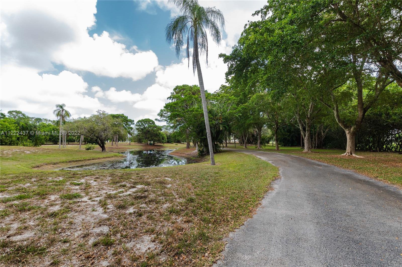 6017 Le Lac Road Boca Raton, FL 33496 - Photo 36 of 46 a view of backyard with trampoline