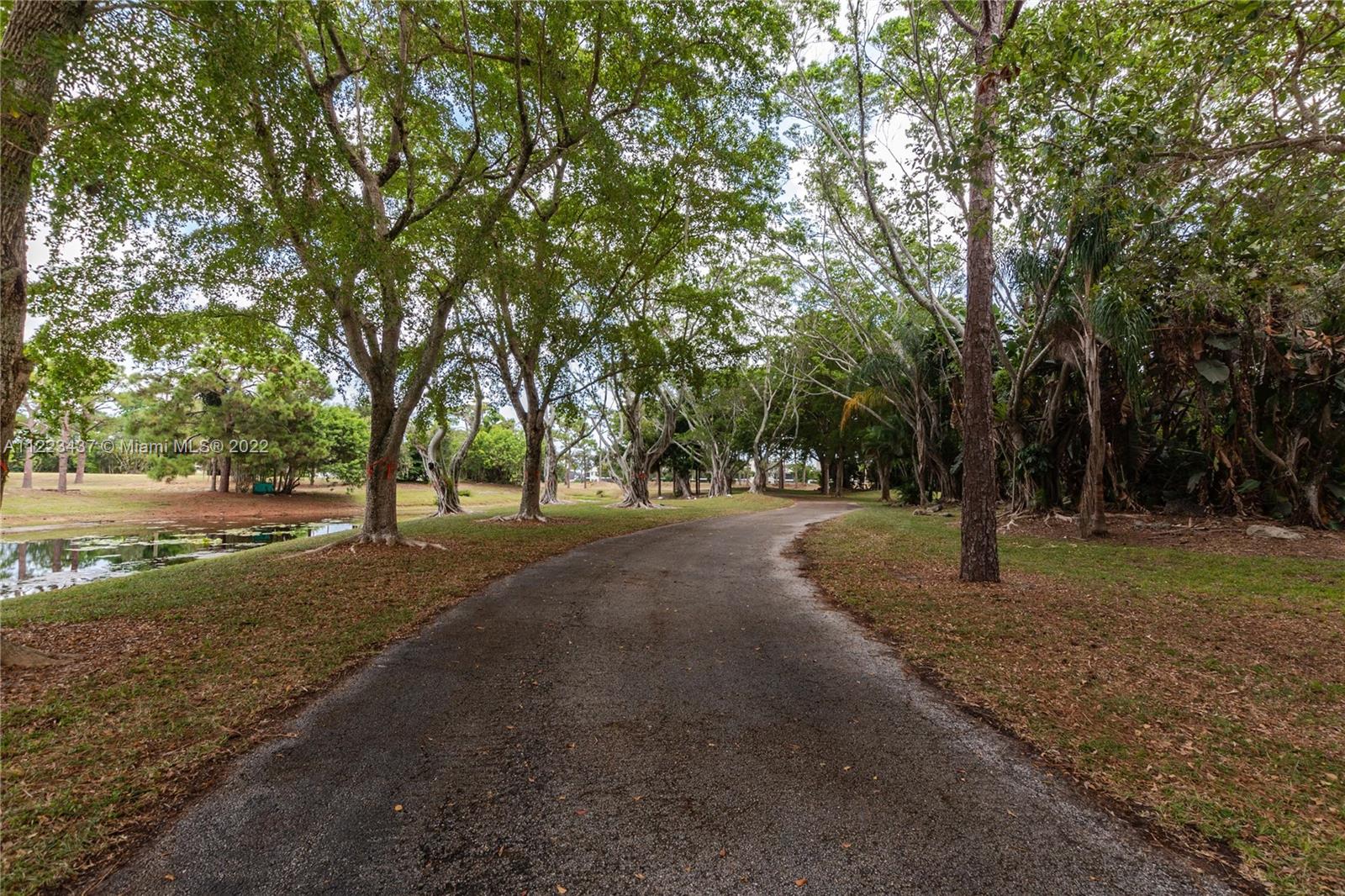 6017 Le Lac Road Boca Raton, FL 33496 - Photo 37 of 46 a view of outdoor space with trees